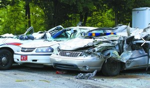 Cars ran over by a tractor.